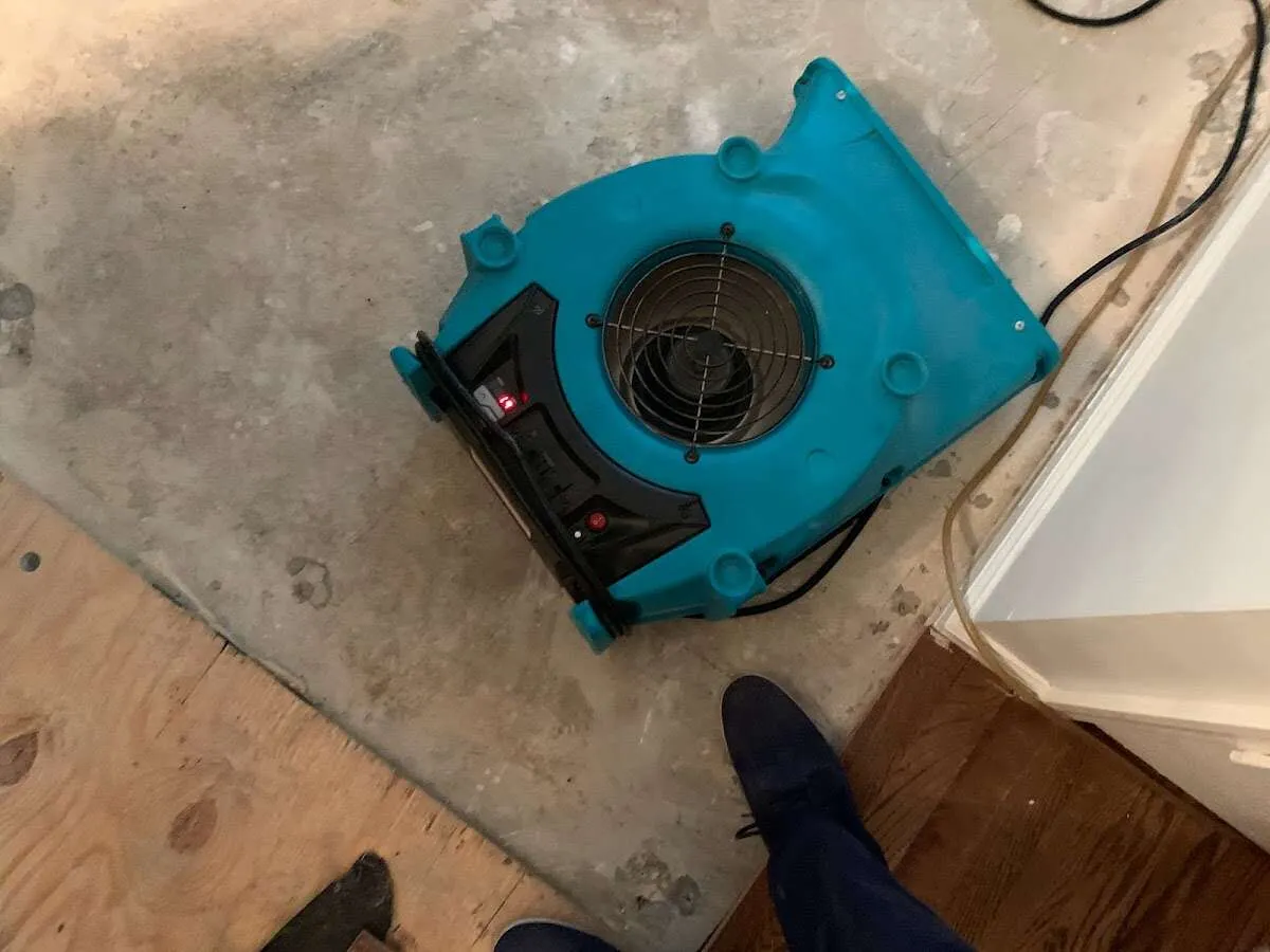 Air mover drying subfloor during Leak Detection & Repair in Ardmore